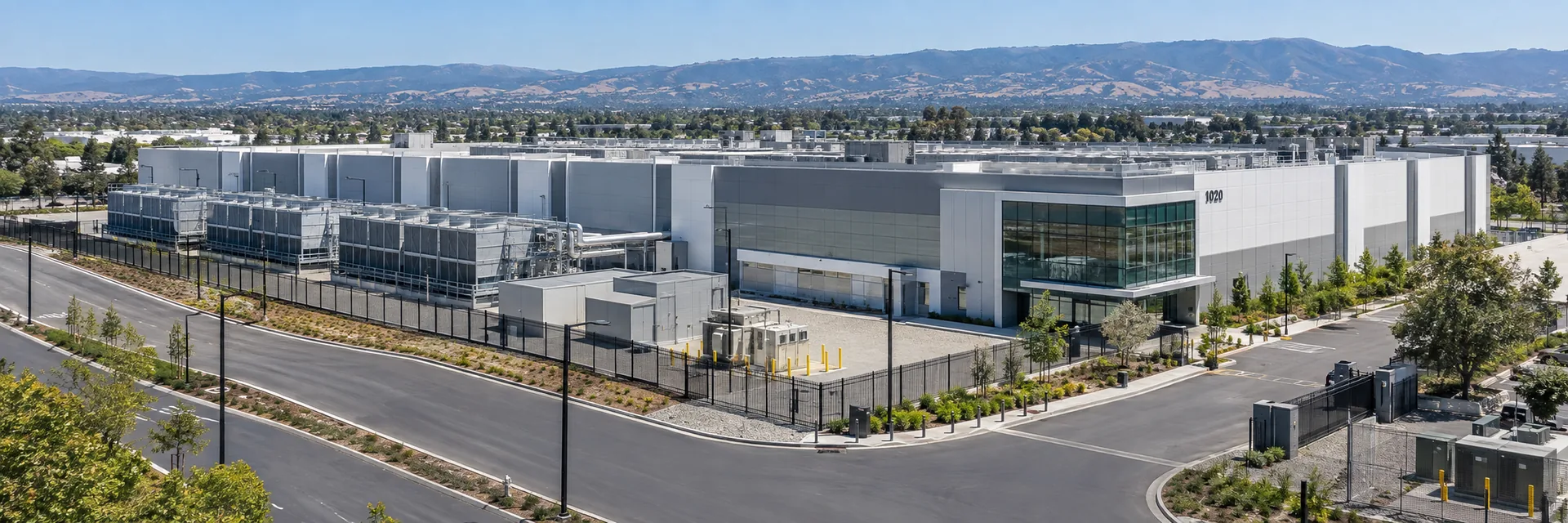A data center aisle lined with server racks — data center owner and operator insurance program